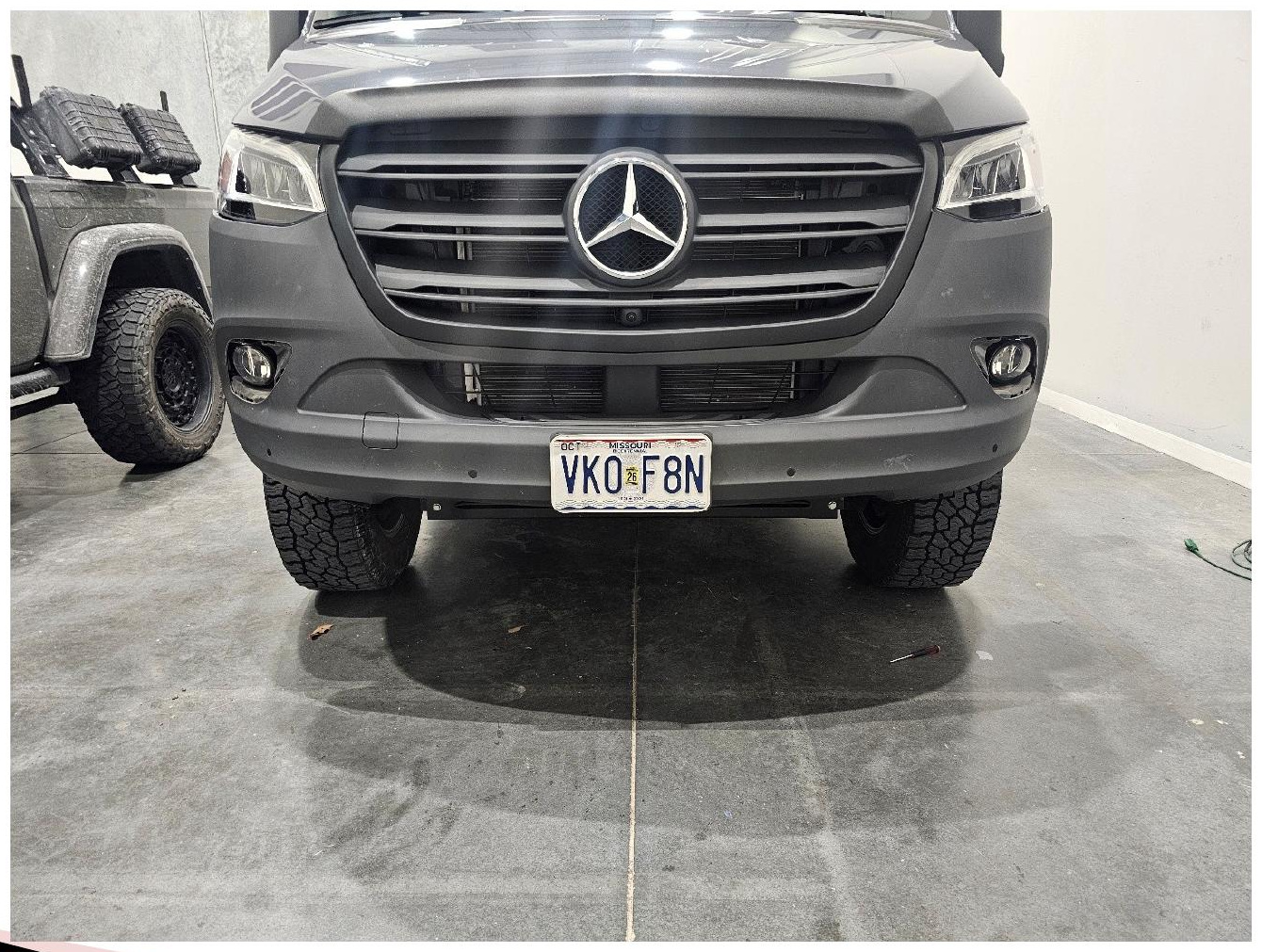 Factory fog light bezel removed from the Sprinter