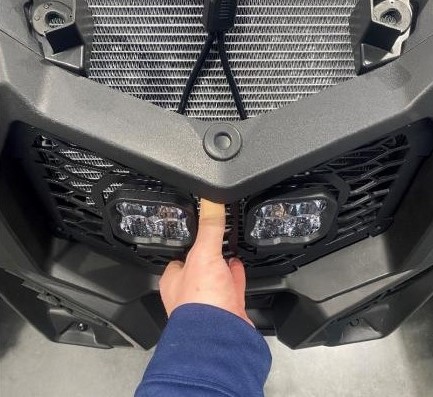 Positioning the assembled SS3 grille in the factory opening