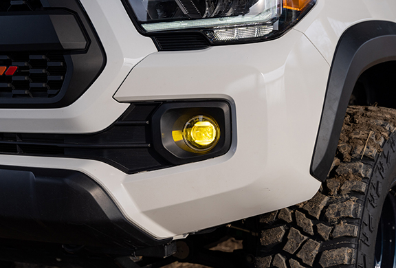 Elite Series LED Fog Light on muddy Toyota Tacoma